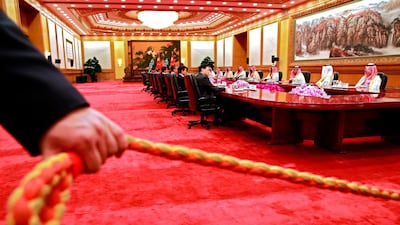 A security officer holds a cordon during the meeting. AFP