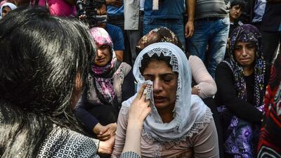 Women cry during a funeral for victims of the attack on a wedding party that left 50 dead in Gaziantep in southeastern Turkey near the Syrian border on August 21, 2016. Ilyas Akengin/AFP