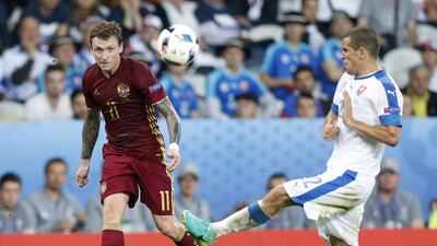Pavel Mamaev of Russia (L) in action against Viktor Pecovsky of Slovakia during the UEFA EURO 2016 group B preliminary round match between Russia and Slovakia at Stade Pierre Mauroy in Lille, France, 15 June 2016. PA/LAURENT DUBRULE