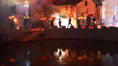 Villagers hold a lantern dragon as they run through villages to celebrate the upcoming Chinese Lantern Festival during Lunar New Year celebrations in Ganzhou, China. Reuters