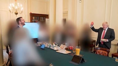An image released as part of the Sue Gray report showing the cabinet room in 10 Downing Street during British Prime Minister Boris Johnson's birthday. Officials not named in the report were blurred out. Reuters