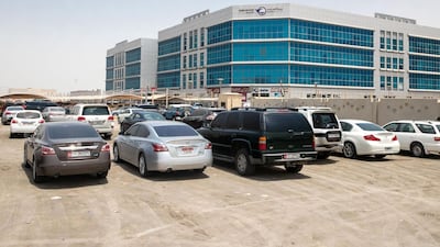 Sand parking lot beside the Khalifa City Post Office. Victor Besa / The National