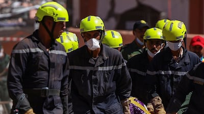 People are carried from rubble in Talat Yaqoub. Reuters