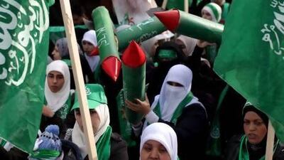 Palestinian supporters of the Islamic movements of Hamas carrying a symbols of M 75 rocket that Hamas fired into Israel last month in a demonstration yesterday.