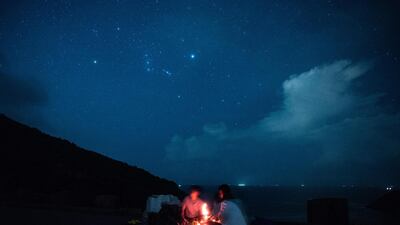 People wait to observe the annual Perseid meteor shower at the east dam of the High Island Reservoir in Hong Kong. AFP