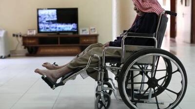 An elderly full-time patient relaxes in the living room of the Ajman Elderly Nursing Home. Patients are only allowed to be admitted if they have no sons or daughters.