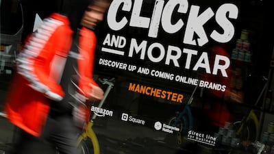 A man walks past the Amazon-backed pop up store 'Clicks and Mortar' in Manchester, Britain, June 3, 2019. REUTERS