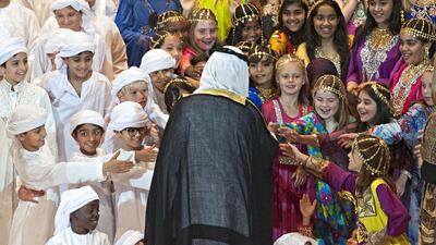 Members of the Combined Children's Choir reach out to shake the hand of Sheikh Nahyan bin Mubarak Al Nahyan, Minister of Culture, Youth and Community Development, at the opening ceremony of the sixth annual Emirates Airline Festival of Literature. Jeff Topping for The National