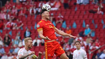 Kieffer Moore - 4: Big Cardiff City striker was booked in first half after catching Kjaer in face with elbow and looked out of his depth against the fleet-footed Danes, albeit with poor service from teammates. Reuters