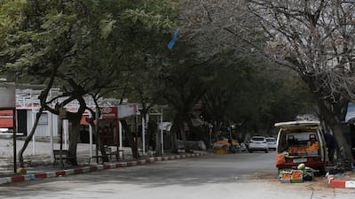 A Palestinian vendor waits to sell vegetables in the West Bank city of Nablus. EPA