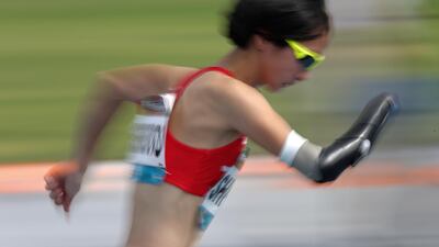 A photo taken using the panning effect shows Sae Shigemoto of Japan in action during the Women's 400m T47 at the World Para Athletics Championships in Dubai, United Arab Emirates. EPA