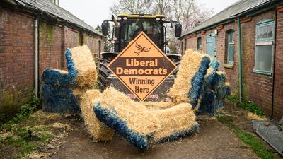 On Wednesday, the leader of the Liberal Democrat Party Ed Davey drove a tractor through bales of hay to promote the launch of their election campaign in Berkhamsted. Getty