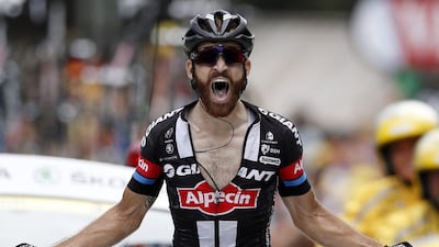 Simon Geschke celebrates as he crosses the finish line to win the 17th stage of the Tour de France. Yoan Valat / EPA