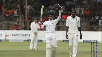 Sri Lanka batsman Dhananjaya de Silva celebrates after scoring 100 runs on Sunday during Day 1 against Zimbabwe. Tsvangirayi Mukwazhi / AP Photo / November 6, 2016