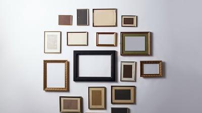 A gallery wall is the ideal way to display memories. Getty