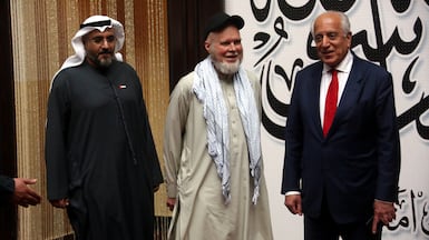 From left, UAE ambassador to Kabul Saif Al Ketbi, US citizen Dennis Coyle and former US special envoy to Afghanistan Zalmay Khalilzad in Kabul on Tuesday. EPA
