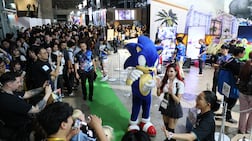 Crowds gather around the Sega and Atlus area at Tokyo Game Show, where major publishers are competing for attention with playable demos, elaborate displays and giveaways. AFP