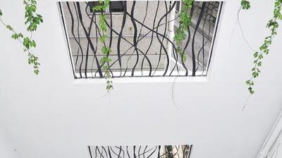 Looking down at the inner courtyard of Anthony and Susan James’s home in Hong Kong. A neutral palette dominates the property’s interior design. Courtesy Red Cover