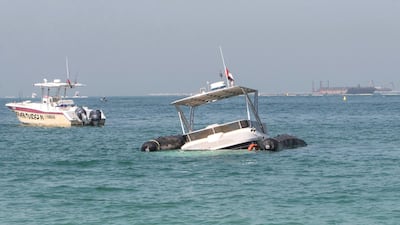 The sunken yacht is located about 200 metres off Jumeirah Beach Residence and is being supported by two inflatable devices. Leslie Pableo for The National