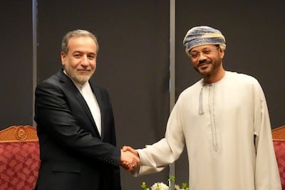 Iranian Foreign Minister Abbas Araghchi thanked Omani Foreign Minister Badr Al Busaidi, right, for his mediation in Muscat on Saturday. AFP