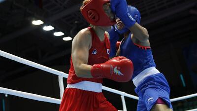 India’s L Sarita Devi lands a punch on Park Ji-na in their bout. India have lodged a protest against the outcome of an Asian Games semi-final bout after judges awarded a unanimous decision to South Korea’s Park Ji-na over L Sarita Devi in the 60-kilogram division, sparking loud verbal abuse from sections of the crowd and condemnation from a coach. Issei Kato / Reuters