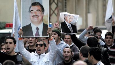 Supporters of former Lebanese prime minister Hariri after Hariri's death outside his house in Beirut. AFP