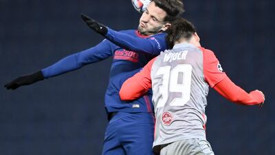 Atletico's Saul Niguezwins a header against Maximilian Wober of Salzburg. EPA