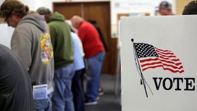 Voters cast ballots at a polling station at the Big Bear Lake Methodist Church in Big Bear, California on November 8, 2016. AFP