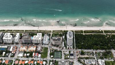 This aerial view shows search and rescue personnel working on site after the partial collapse of the Champlain Towers South in Surfside, north of Miami Beach. Chandan Khanna / AFP