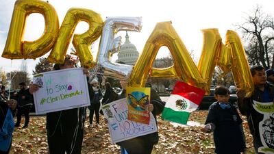 Demonstrators hold up balloons during an immigration rally in support of the Deferred Action for Childhood Arrivals. Jose Magana / AP