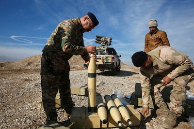 Iraqi army personnel check ammunition during clashes with ISIS militants north of Mosul in December 2016. Reuters