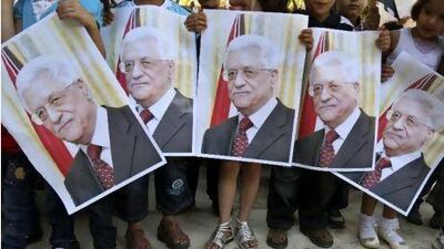 Palestinian children hold posters of Palestinian President Mahmoud Abbas during a rally near the West Bank city of Nablus yesterday. Nasser Ishtayeh / AP Photo