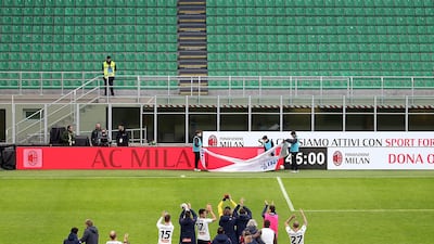 Genoa players celebrate after the Italian Serie A soccer match at AC Milan. EPA