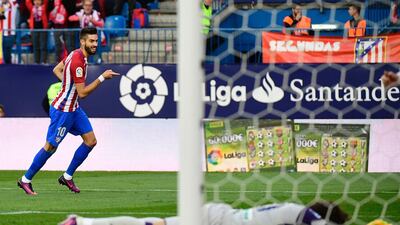 Atletico Madrid’s Belgian midfielder Yannick Ferreira Carrasco celebrates after scoring his second goal against Granada. He later went on to complete his hat-trick. Pierre-Philippe Marcou / AFP