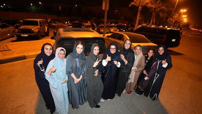 Saudi women celebrate after they drove their cars in Al Khobar, Saudi Arabia, June 24, 2018. Hamad I Mohammed / Reuters