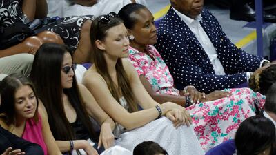 Designer Vera Wang, left, watches from the stands. Reuters