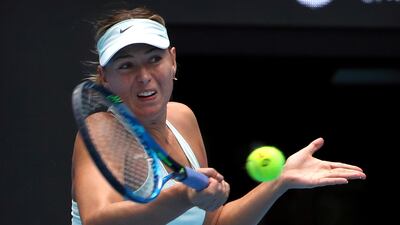 Maria Sharapova of Russia returns a shot against Ekaterina Makarova of Russia in their women's singles match in the China Open. Mark Schiefelbein / AP Photo