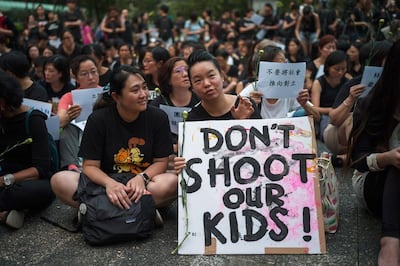 A group of Hong Kong mothers attend a rally in Hong Kongafter starting an online petition, signed by tens of thousands to voice their disagreement with Ms Lam's analogy likening herself and protesters of the extradition bill to a mother and her spoiled children. EPA