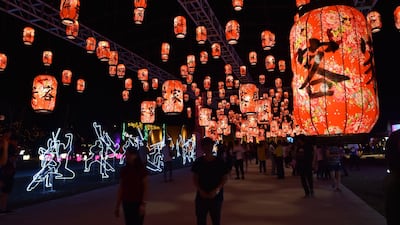 Guests walk down a pathway decorated with traditional red lanterns. Courtesy Taiwan Tourism