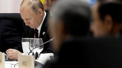 Mr. Putin attends a working lunch. EPA