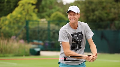World No 8 Jannik Sinner warms-up at the All England club. Getty