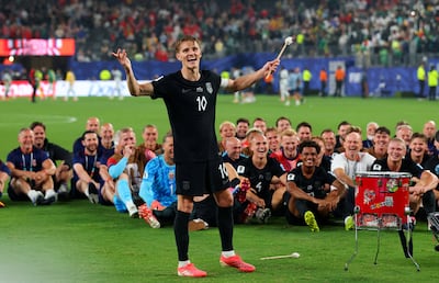 Martin Odegaard leads Norway’s players in the Viking Row after their win over Senegal, as the squad joined supporters in the celebration. Reuters