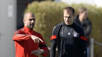 Pep Guardiola, left, has largely avoided criticism from his superiors and Bayern Munich’s fans. That will change if they fail to reach the Uefa Champions League quarter-finals. Christof Stache / AFP
