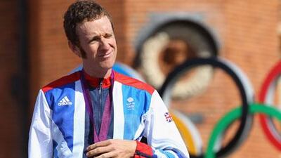 Bradley Wiggins with his gold medal after winning the Men's individual time trial road cycling