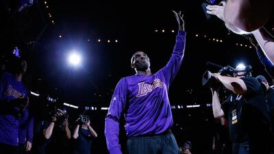 Kobe Bryant of the Los Angeles Lakers waves to the crowd in Oakland before his team's NBA game against the Golden State Warriors on Thursday night. Ezra Shaw / Getty Images / AFP / January 14, 2016