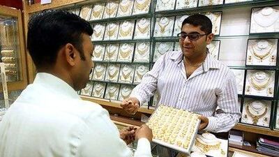 Krish Kumar, right, the business development manager at Kiran Jewellers in Sharjah.