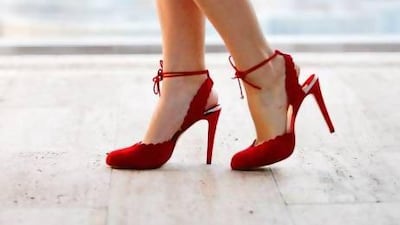 The Tala: pillar-box red, soft suede pump with ankle strap; classic shoe with scalloped detailing. Sarah Dea / The National