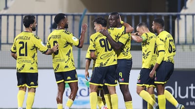 Mario Balotelli is congratulated by Al Ittifaq teammates after scoring his first goal for the club in a 3-1 defeat to Al Arabi.
