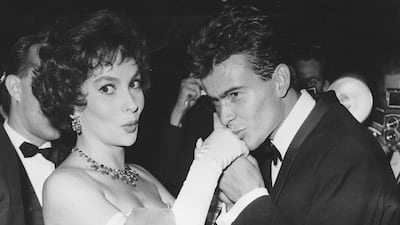 German actor Horst Buchholz with Lollobrigida at the Berlin International Film Festival in 1958. AP
