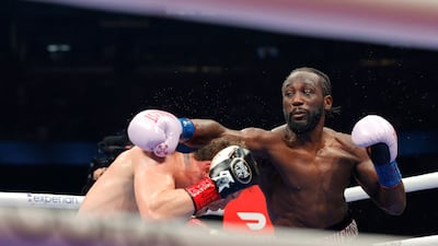 Canelo Alvarez ducks under a lead from Terence Crawford. Getty Images